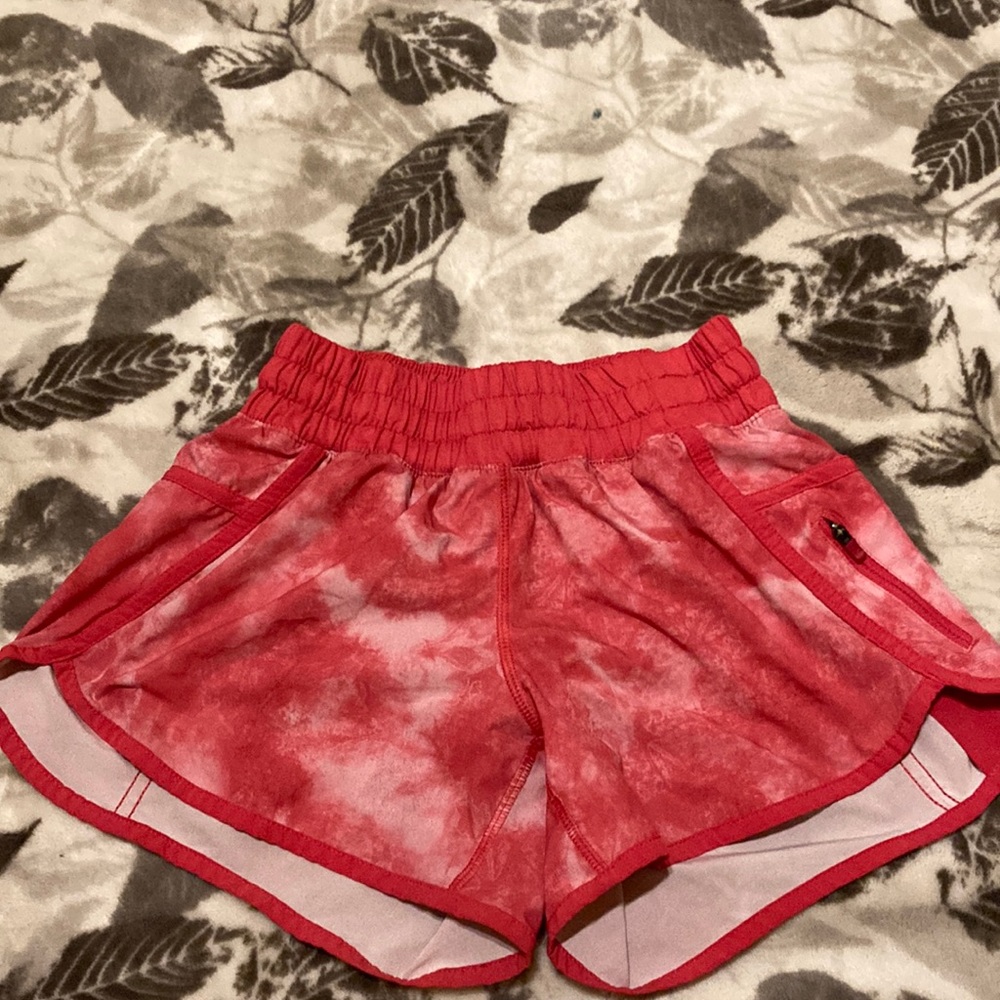 Lululemon pink shorts has a zipper pocket on the left